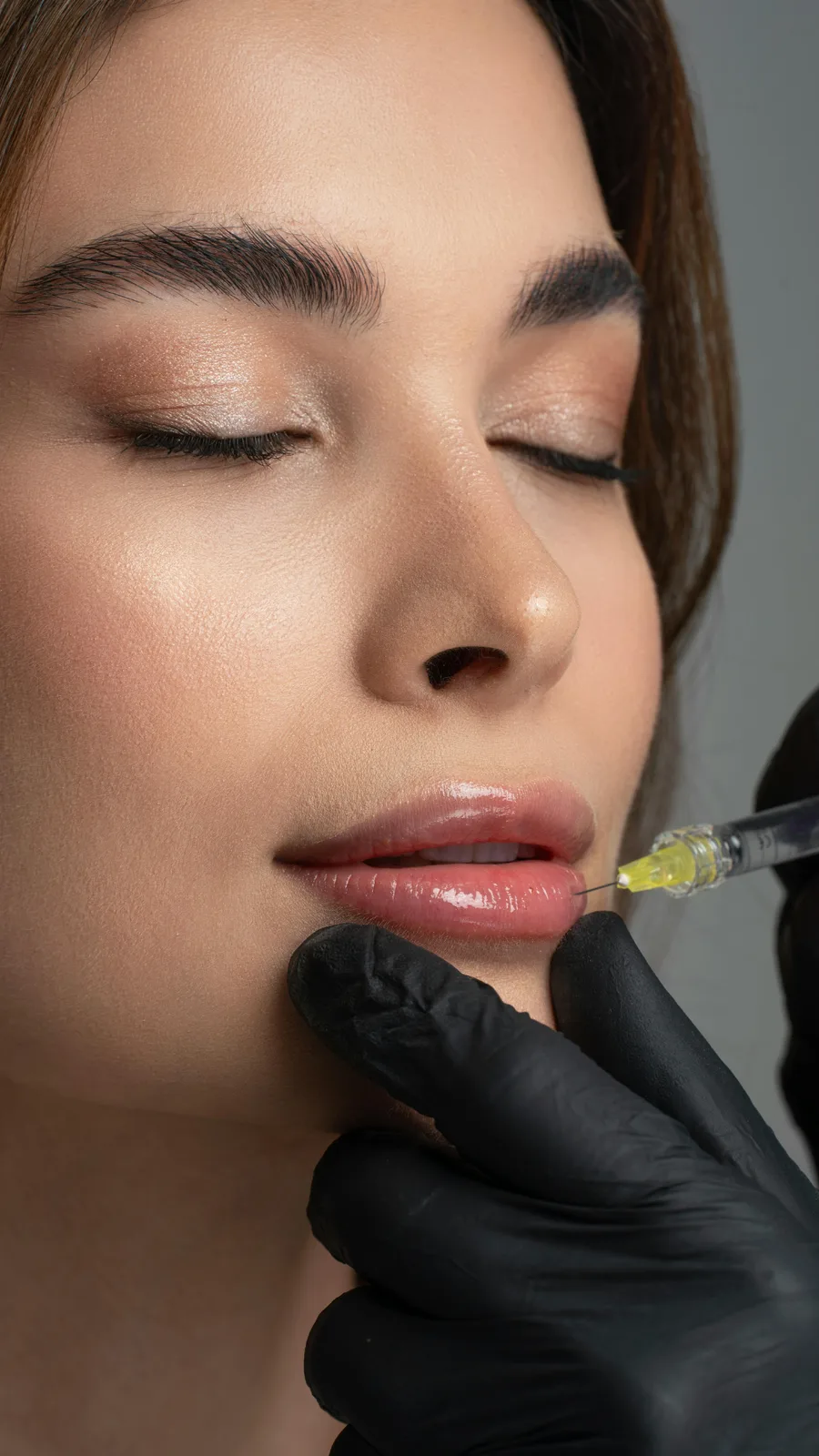 Lip filler injection with a fine needle at Advanced Aesthetics