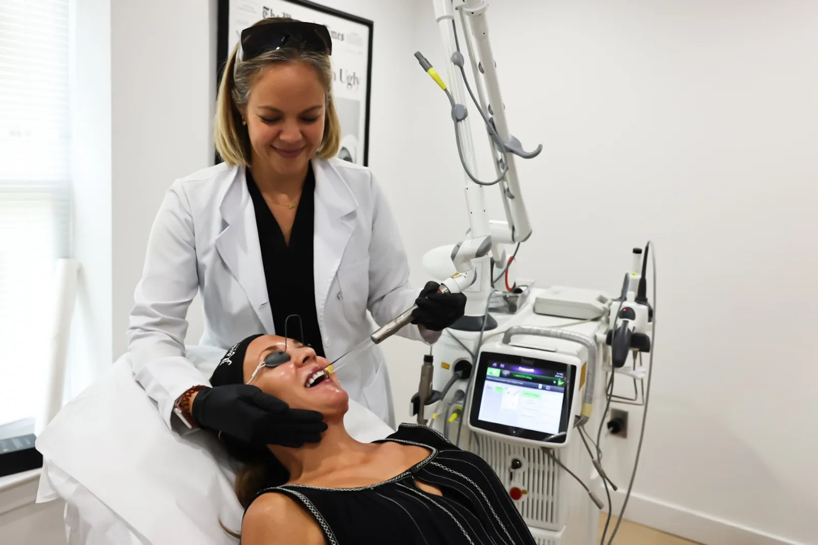 Provider giving a Fotona SP Dynamis laser treatment at Advanced Aesthetics, Medford and Braintree MA