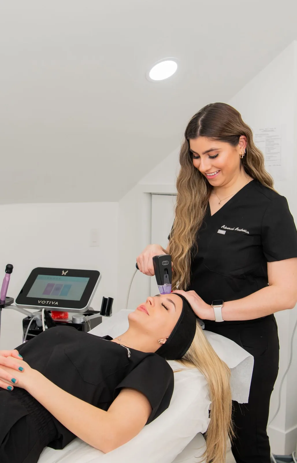 Provider preparing a patient for Morpheus8 at Advanced Aesthetics